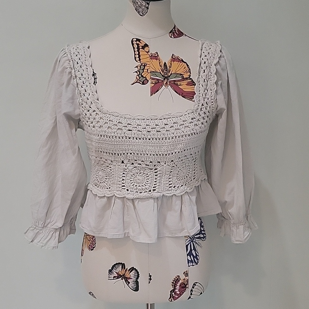 REBELLION again beige crochet top. Ruffled sleeves. Size is Large. 100% cotton